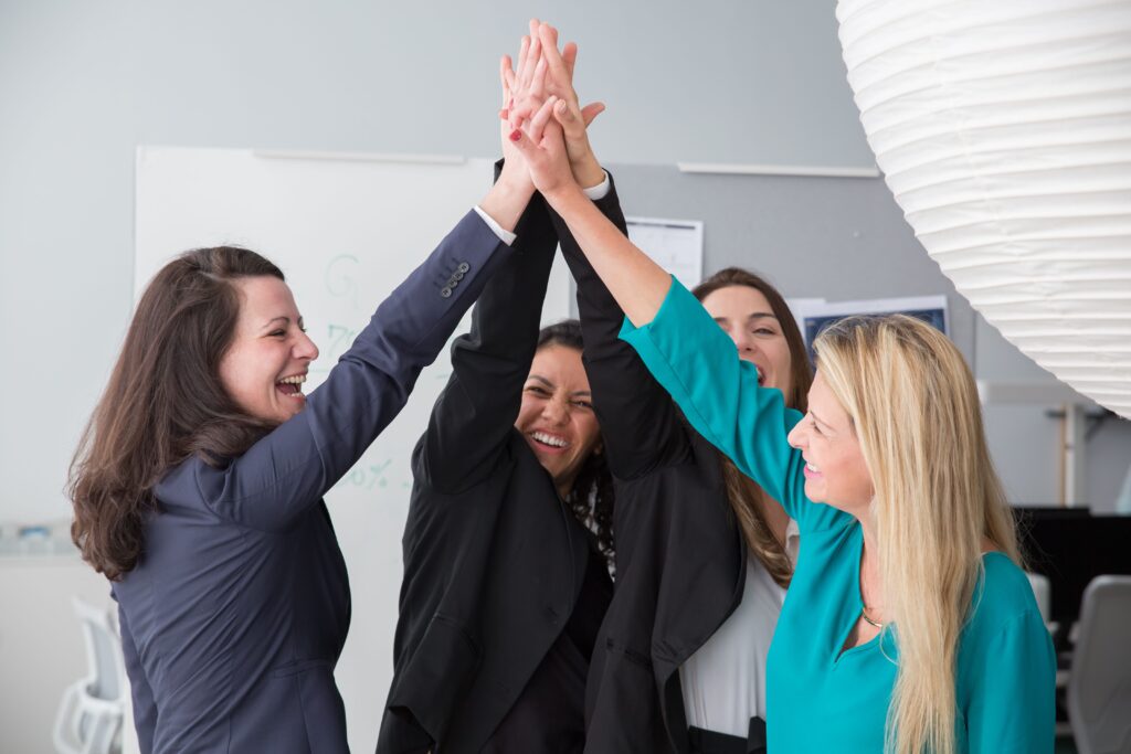 pexels-photo-8171179-8171179 Group of enthusiastic businesswomen achieving a success with a high five.